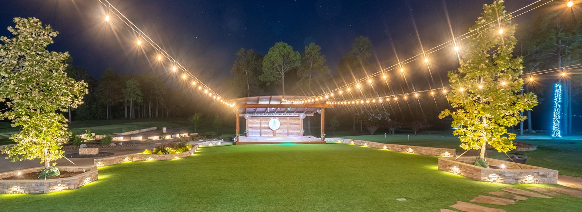 Wide night shot of the Lawn at Rayburn Resort